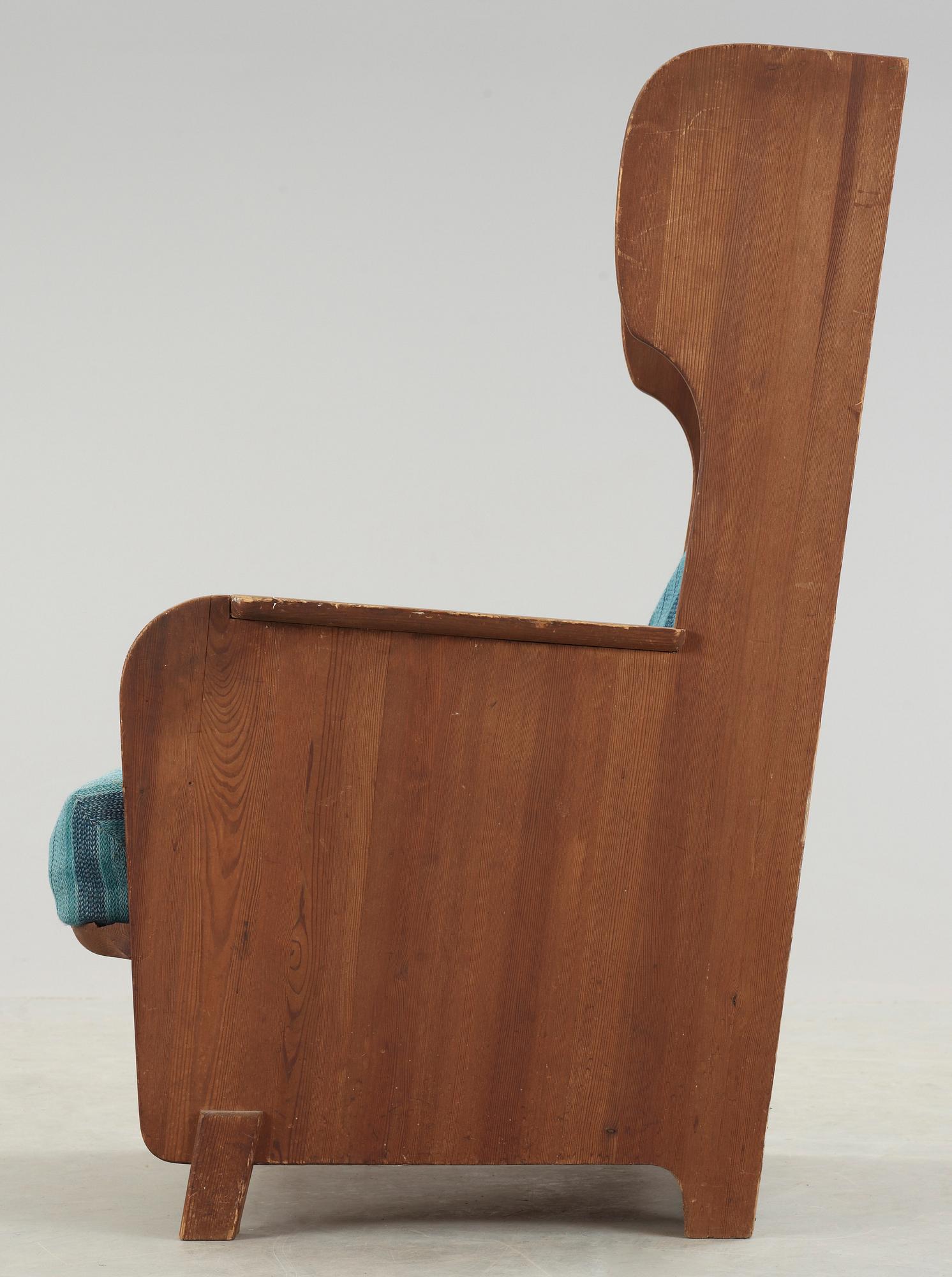An Axel Einar Hjorth 'Lovö' stained pine armchair, Nordiska Kompaniet, Sweden 1930's.