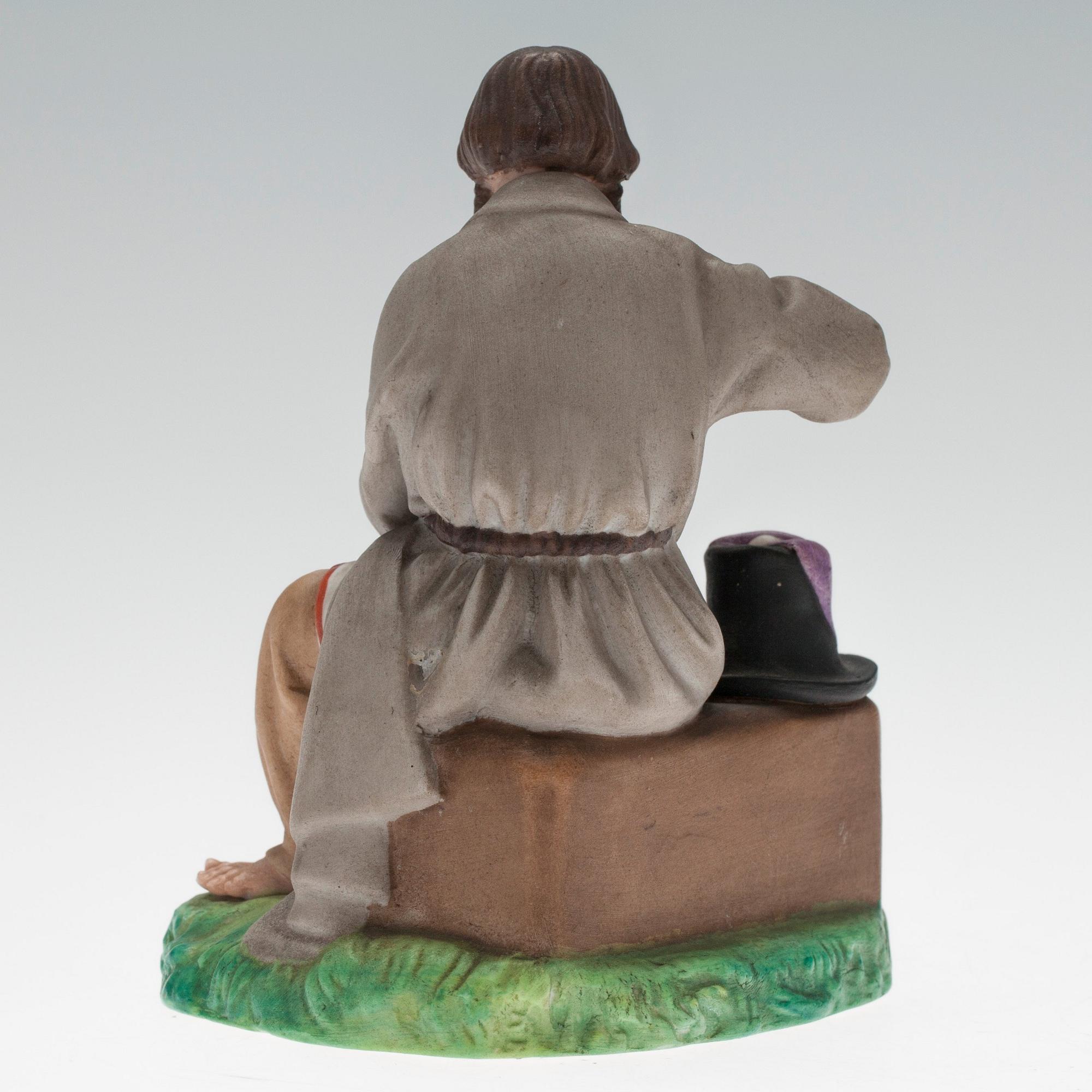 A FIGURINE.