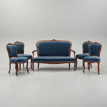 A sofa and a set of four chairs, Rococo revival, late 19th century.