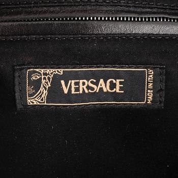 VERSACE, a black patented leather handbag.