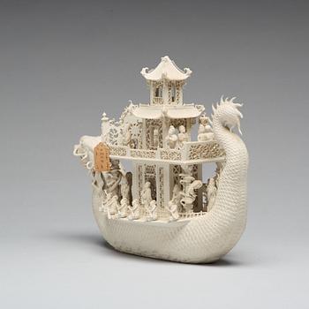 A biscuit porcelain dragon boat of 'Assembly of Immortals', Qing dynasty, Daoguang, signed Chen Guozhi, 19th century.