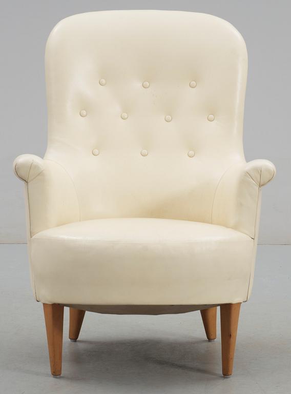 A Carl Malmsten 'Marino' white leather easy chair.