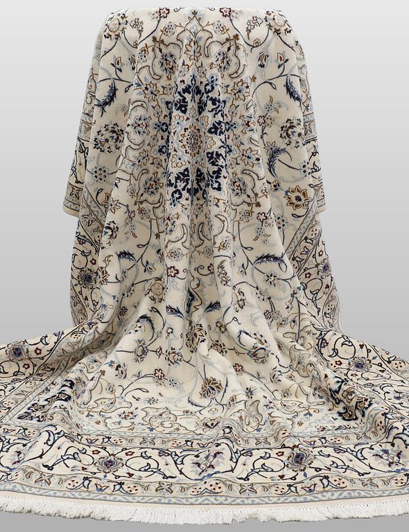 A Nain carpet, part silk, so-called 9 LAA, approx. 355 x 248 cm.