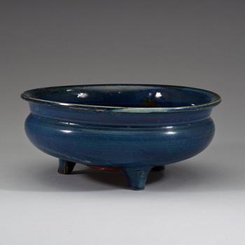 A large blue glazed tripod censer, Qing dynasty (1644-1912).