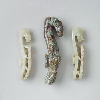 A set of three Chinese belt buckles, 20th Century.