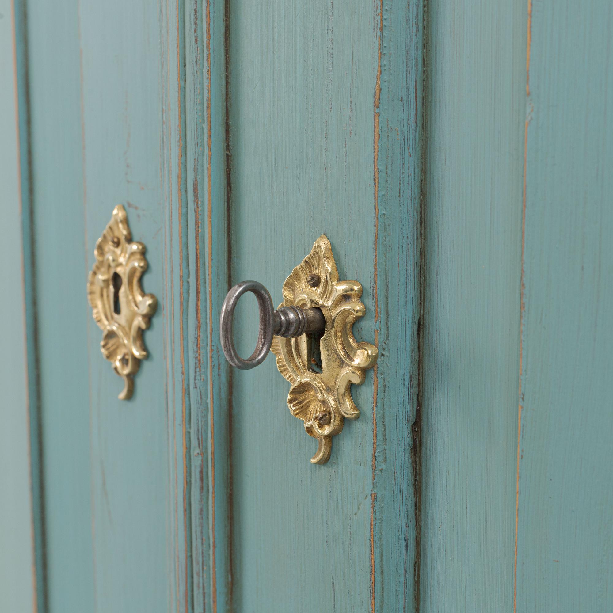 A corner display cabinet, 19th century with a later base.