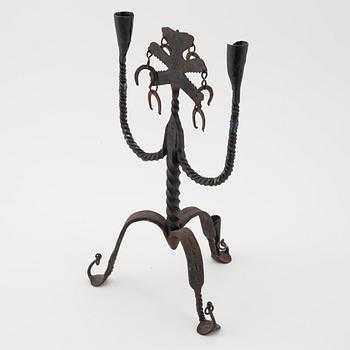 A Seedish wrought-iron three-light candlestick, circa 1900.