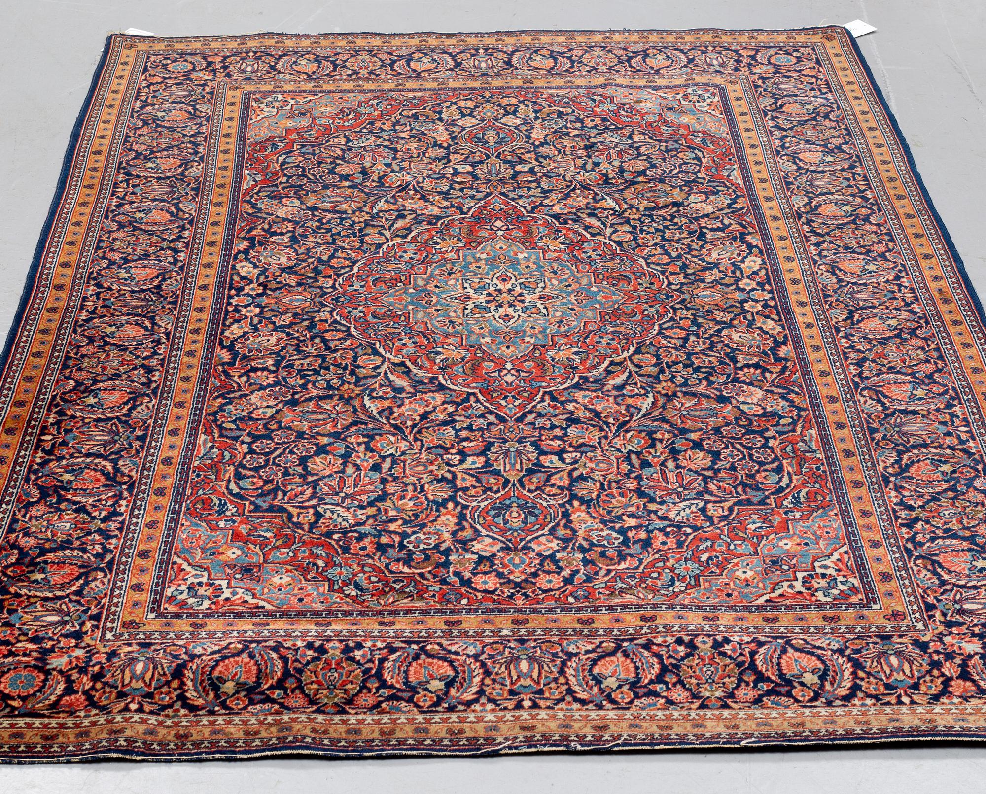 MATTO, a semi-antique Kashan, ca 203,5-205,5 x 135-137,5 cm.