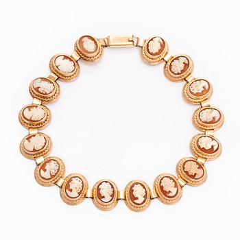 A 14K gold and shell cameo jewelry set, bracelet, pendant/brooch and ring.