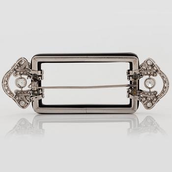 Janesich Art Deco brosch med onyx och gammal- och åttakantslipade diamanter.