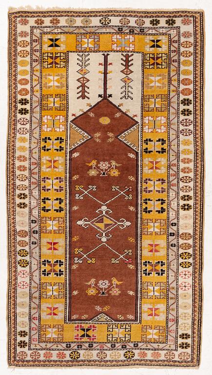 A semi-antique anatol rug, c. 208 x 114 cm.