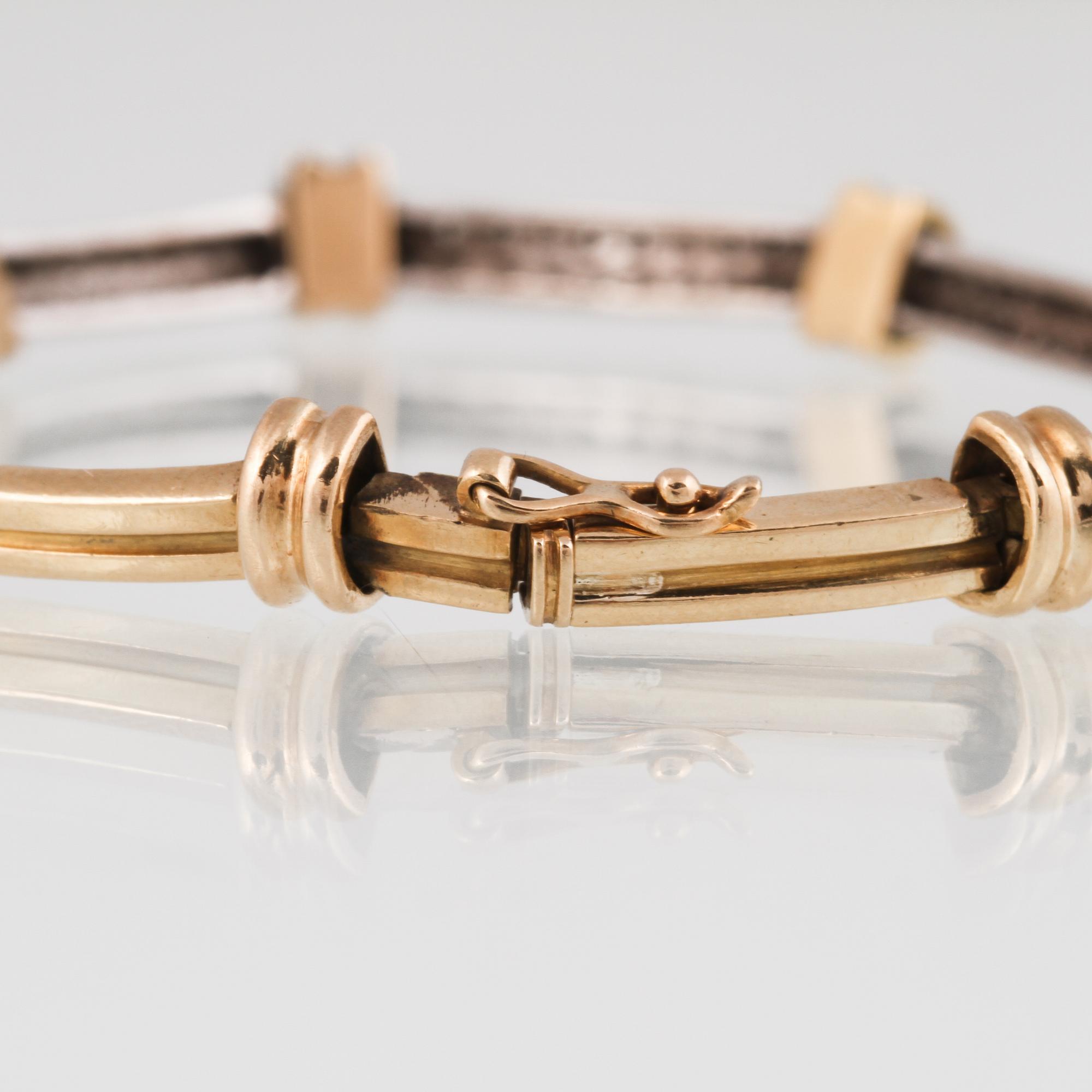ARMBAND, 18K vitguld och guld med 60 små briljantslipade diamanter. Vikt 13,3 gram.