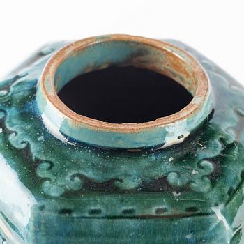 A green glazed jar and an olive glazed pot with handles, Qing dynasty, 19th Century.