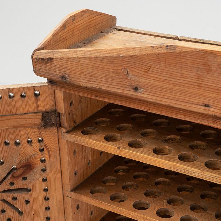A late 19th century pine cupboard for eggs.