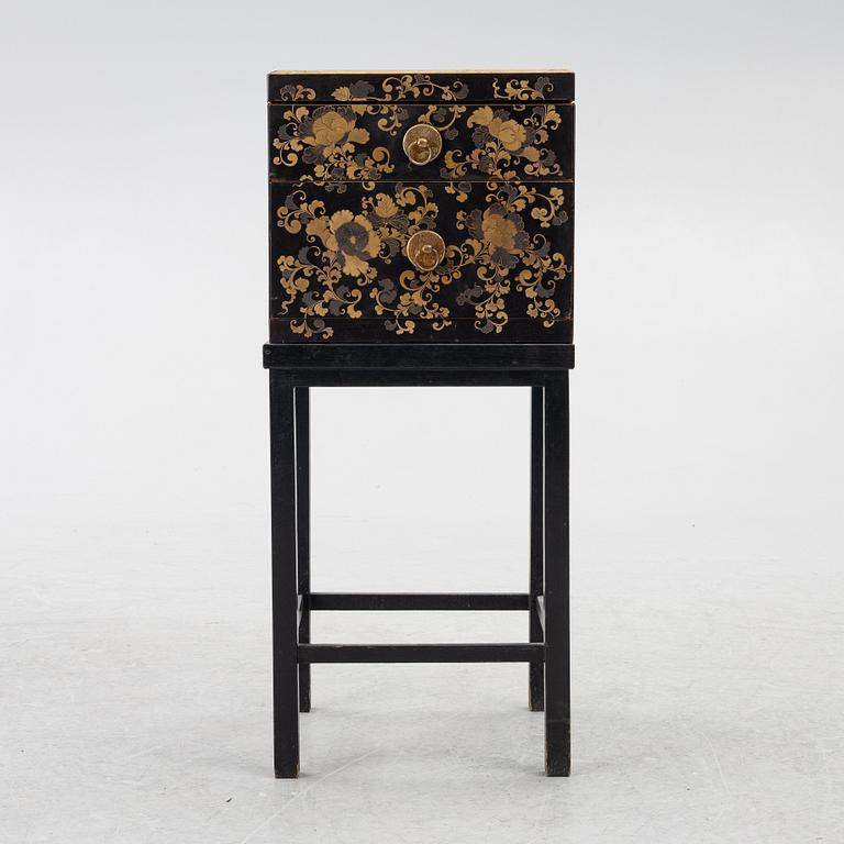 A lacquered end table/box with stand, Japan, 20th century.