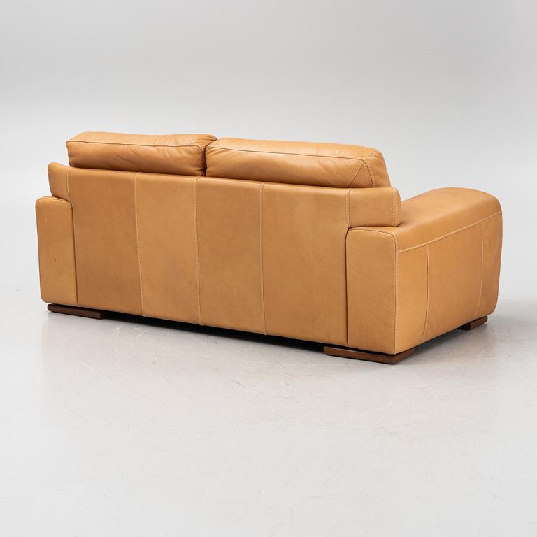 A leather upholstered sofa from Natuzzi.