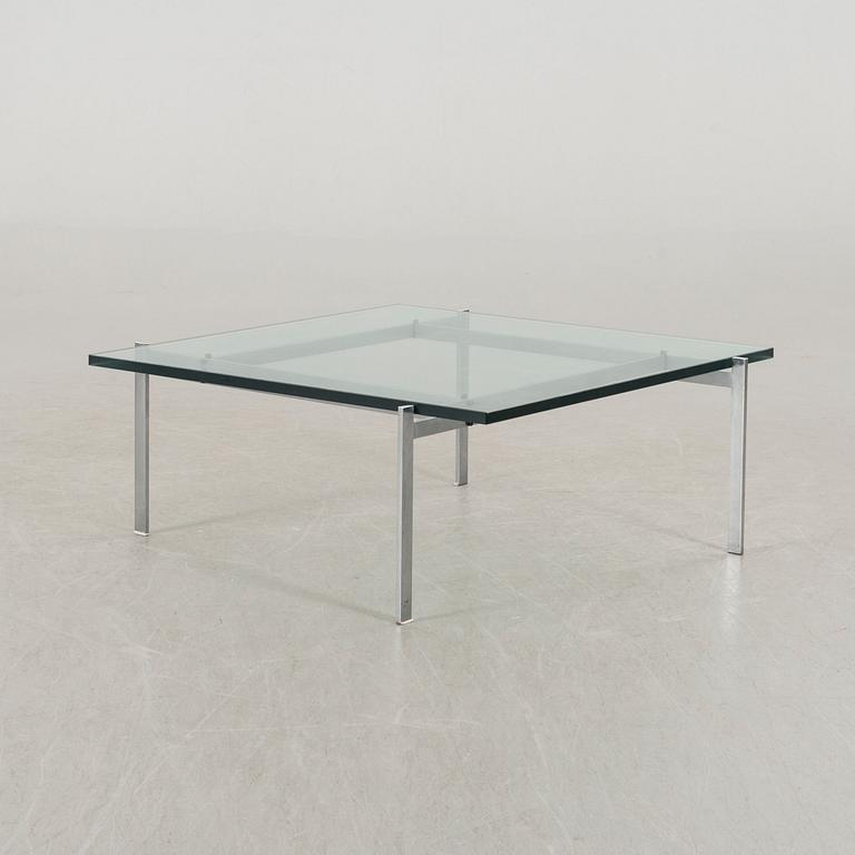 A Poul Kjaerholm PK61 glass table by Fritz Hansen.