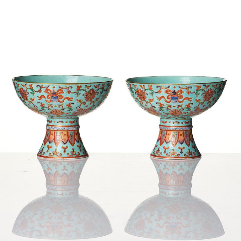 A pair of rare turquoise ground 'baijiaxiang' stemcups, Qing dynasty with Daoguang mark and period (1821-1850).