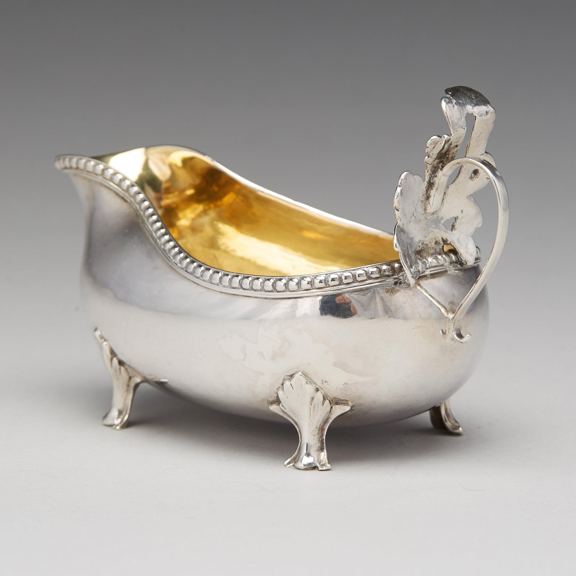 A Swedish Rococo parcel-gilt silver cream-jug, mark of Petter Åkerman, Stockholm 1778.