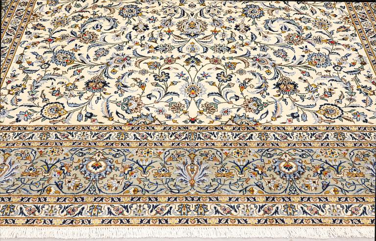 A Keshan carpet, signed, approx. 390 x 282 cm.