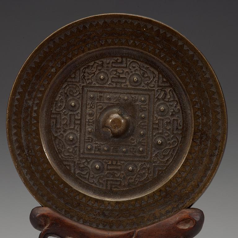 Ana archaistic bronze mirror.