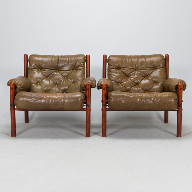 A pair of leather armchairs, 1970s.