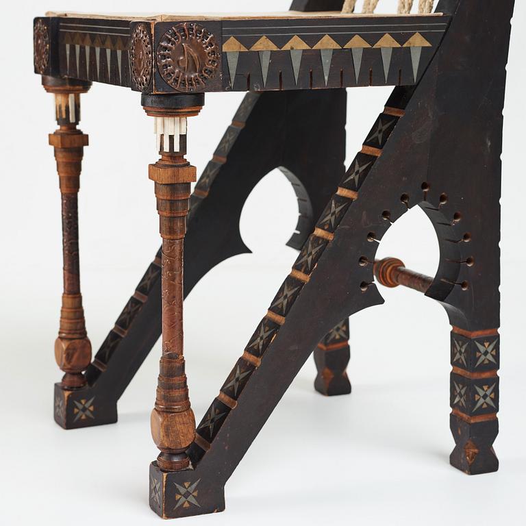 Carlo Bugatti, CARLO BUGATTI, an ebonized wood and walnut chair, Turin, Italy ca 1900.