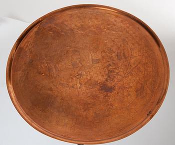 An Anna Petrus table, Sweden early 1920's. Sculptured oak with an engraved copper tray.