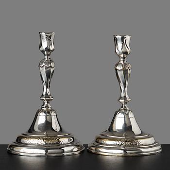 111. A pair of Rococo candlesticks by Anders Westerberg (privilege 1755, dead 1765, his widow continued till 1773).