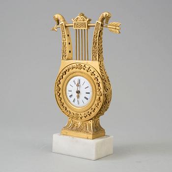 A TABLE CLOCK, empire, early 19th century.