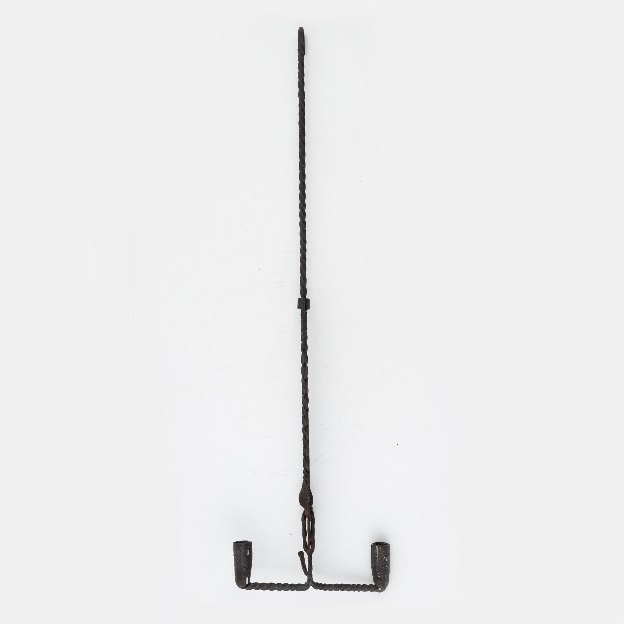 A wrought-iron two-light candlestick, 19th/20th Century.