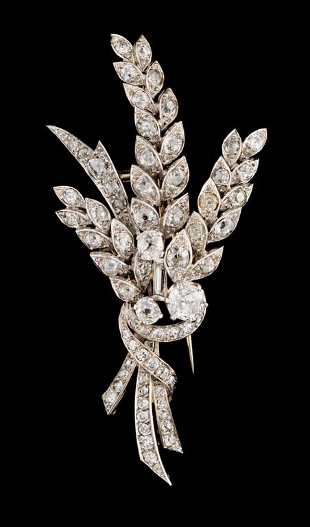 A gold, platinum and diamond brooch.