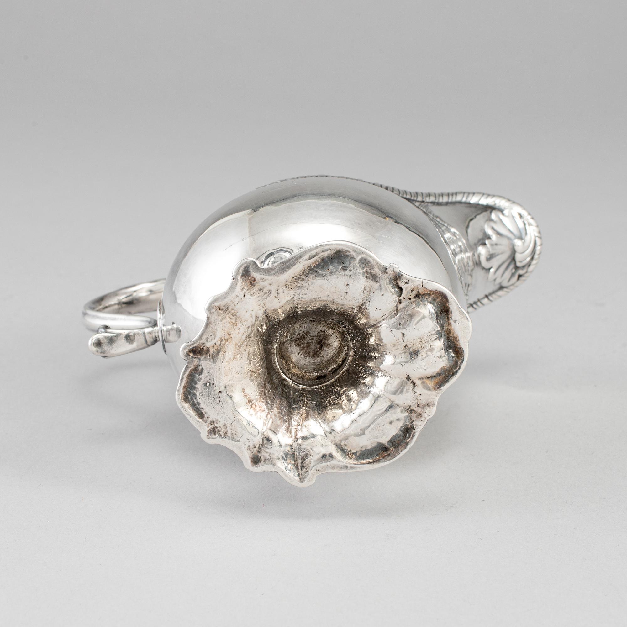 An English 18th century silver sauce-boat, unidentified makers mark, London 1764.