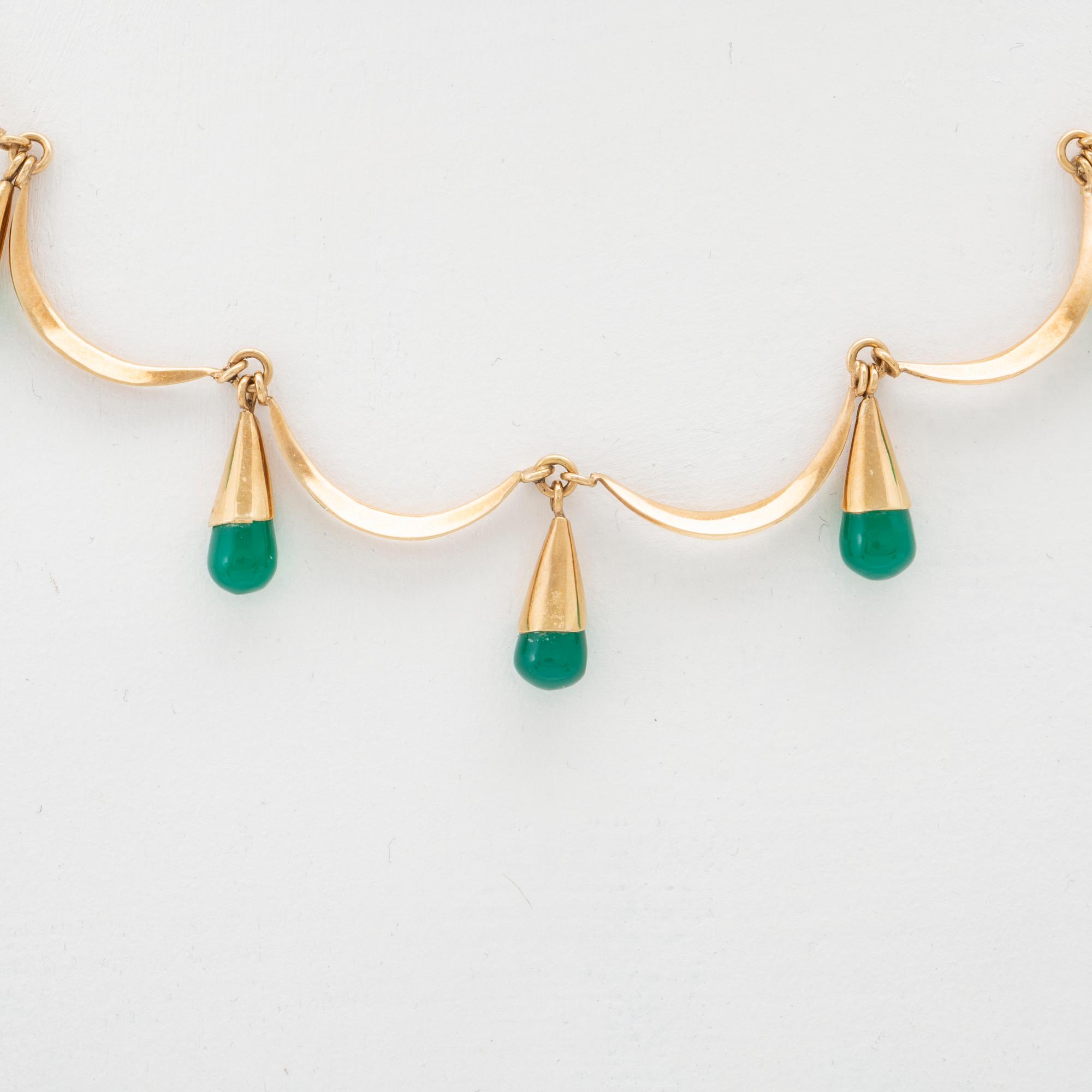An 18K gold neckalce and a pair of earring set with green stones.