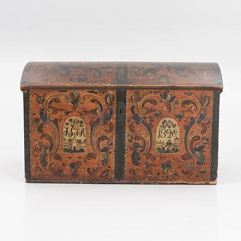 A wooden Dalecarlian chest, Sweden, dated 1820.