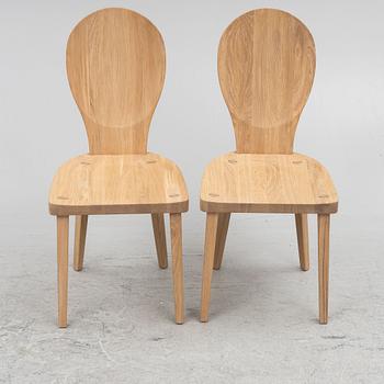 Carl Malmsten, a pair of "Skedblad" chairs, Tre Sekel, Sweden, 21st century.