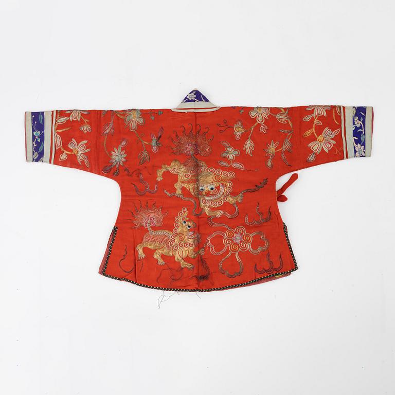 A Chinese embroidered silk jacket for children, late Qing dynasty, around 1900.