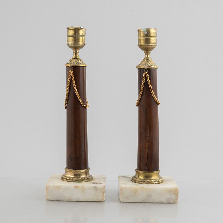 A pair of late Gustavian gilt brass, marble and birch candlesticks, circa 1800.