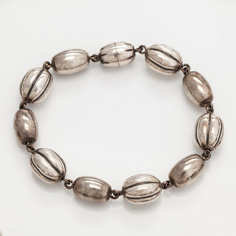 Kalevala Koru, a set of sterling silver "Halikko treasure" necklace, bracelet, ring and earrings. Helsinki 1994.