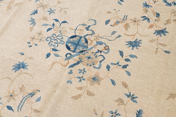 A semi-antique China/Nepal carpet, c, 385 x 297 cm.