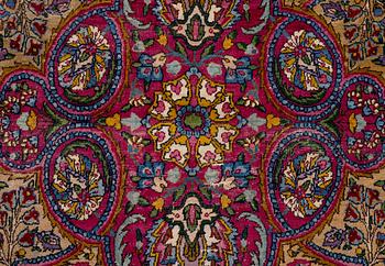 A semi-antique Kirman carpet, south Persia, c. 440 x 279 cm.