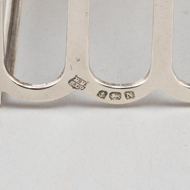 a set of four silver toastracks, Barker Brothers Birmingham 1936.