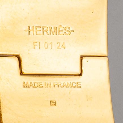 HERMÈS, a 'Clic H' bangle.