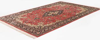 A 1960's silk Qum carpet, c. 312 x 201 cm.