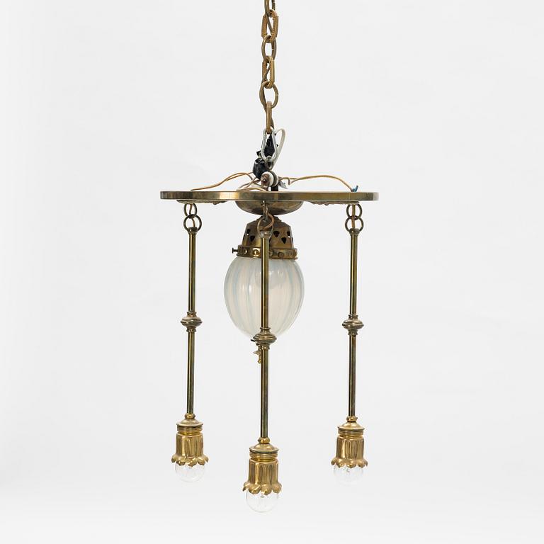 An Art Nouveau brass and glass table light, early 20th Century.