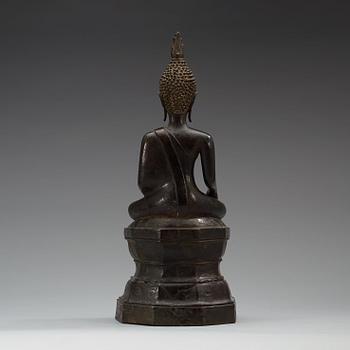 A large seated bronze figure of buddha, Thailand, 19th Century or older. With inscription to base.