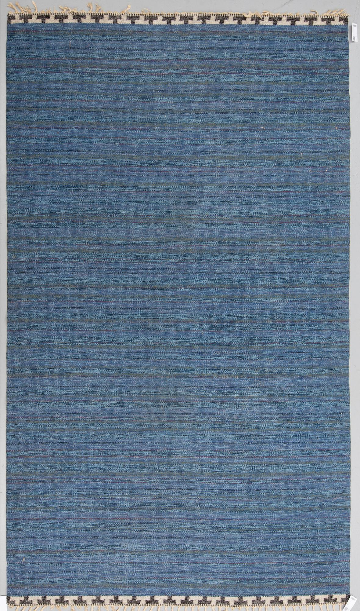 A CARPET, flat weave, atributed to Rakel Carlander, around 306 x 197 cm.
