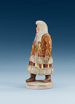 A Russian bisquit figure of a Saami woman from Mezen, Central Porcelain Trust, Dimitrovski, Verbilki, Moscow, 20th Century.