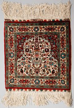 Four silk rugs/pads, probably Hereke, ca 33 x 33 cm.