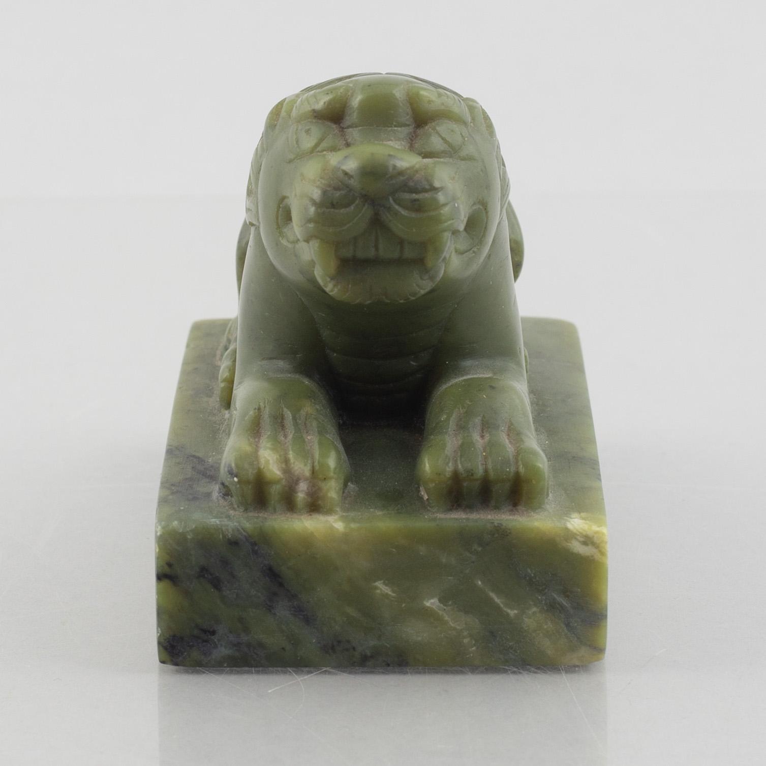 A Chinese stone figure of a lion, 20th century.